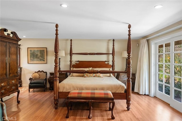 bedroom with light wood-style floors and recessed lighting