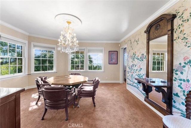 carpeted dining area with an inviting chandelier, wallpapered walls, baseboards, and crown molding