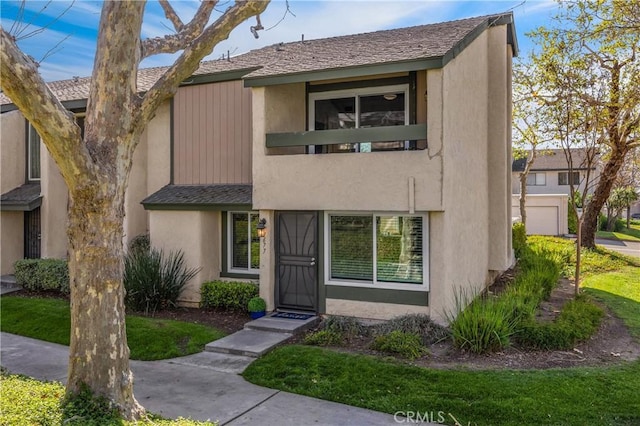 townhome / multi-family property featuring stucco siding