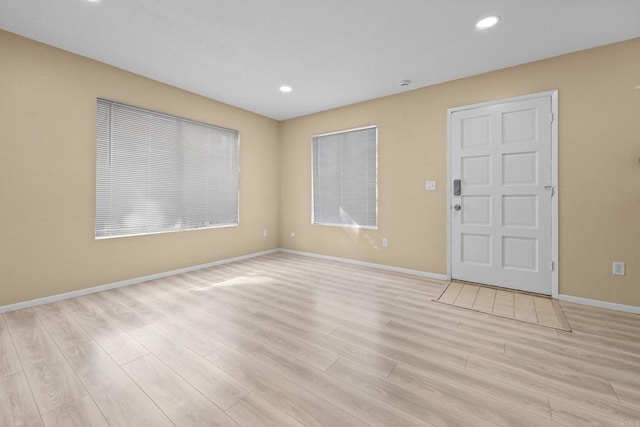 interior space featuring recessed lighting, light wood-style flooring, and baseboards