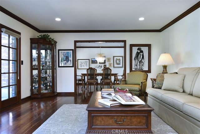 living area featuring dark wood-style floors, recessed lighting, baseboards, and crown molding