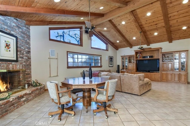 dining space with wooden ceiling, light tile patterned floors, and a fireplace