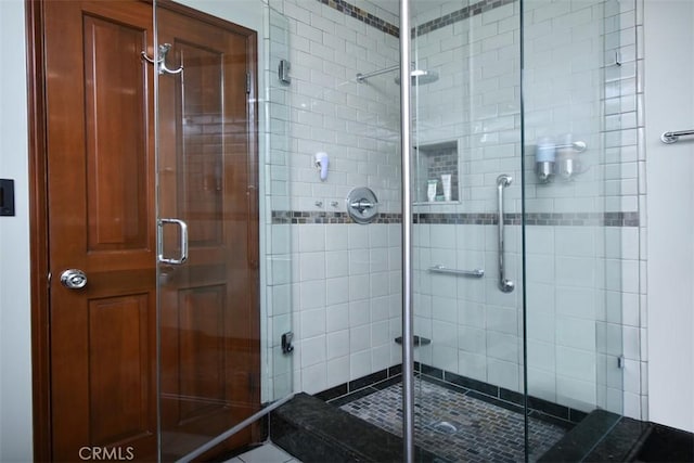 full bath featuring a shower stall