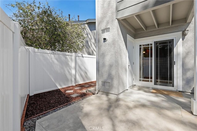 view of patio featuring fence