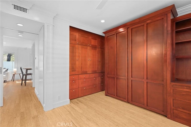 interior space featuring light wood-type flooring and visible vents