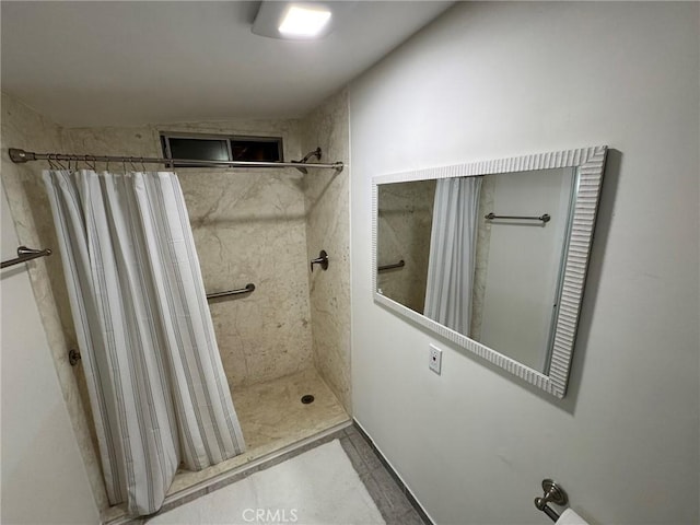 bathroom with a shower stall