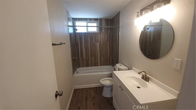 full bath featuring wood finished floors, bathing tub / shower combination, toilet, and vanity