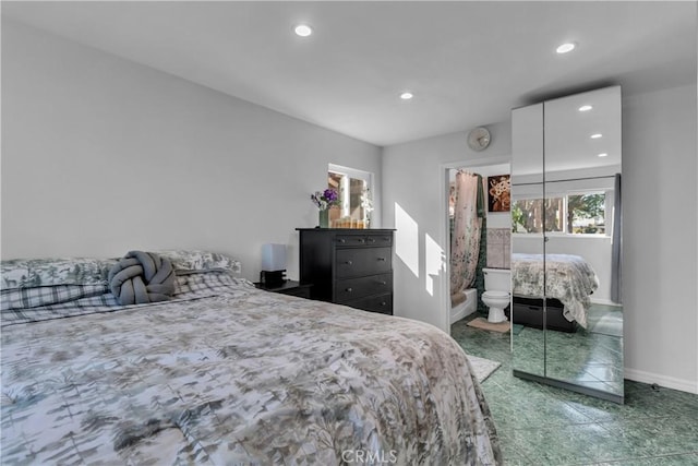 bedroom featuring baseboards, a closet, and recessed lighting