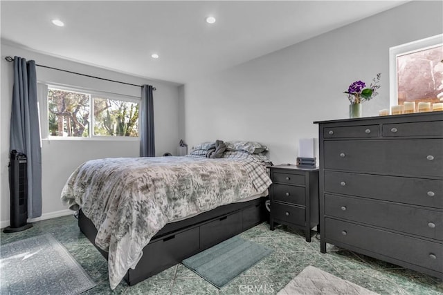 bedroom featuring baseboards and recessed lighting