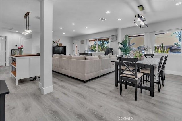 dining space with light wood-style floors, visible vents, baseboards, and recessed lighting