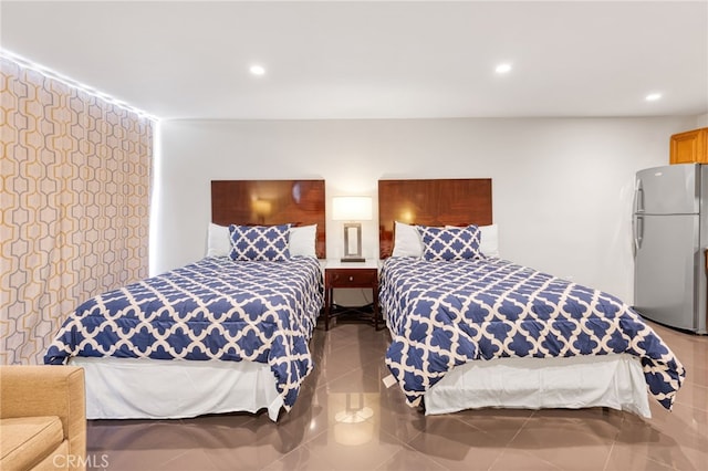 tiled bedroom featuring freestanding refrigerator and recessed lighting