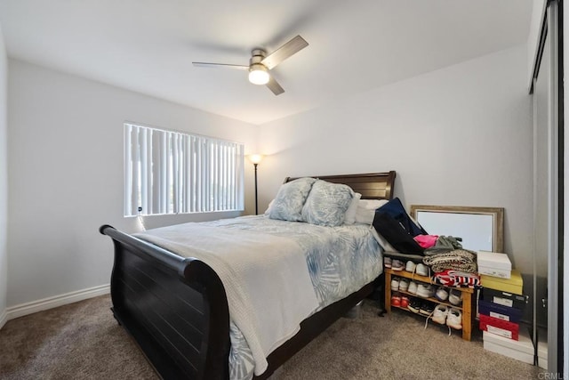 carpeted bedroom with a ceiling fan and baseboards