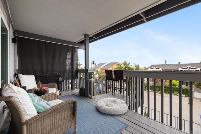 wooden terrace with outdoor lounge area