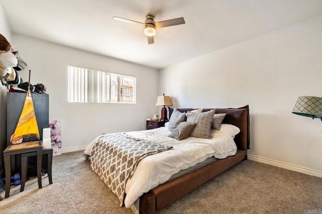 bedroom featuring ceiling fan, carpet flooring, and baseboards