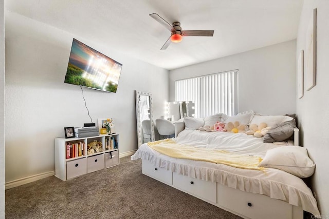 bedroom featuring ceiling fan, dark carpet, and baseboards