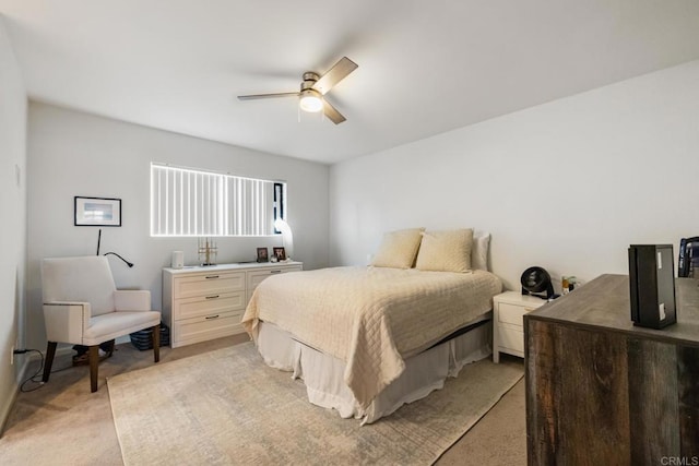 bedroom with light carpet and ceiling fan