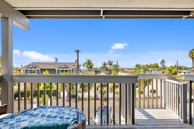 wooden deck with a residential view