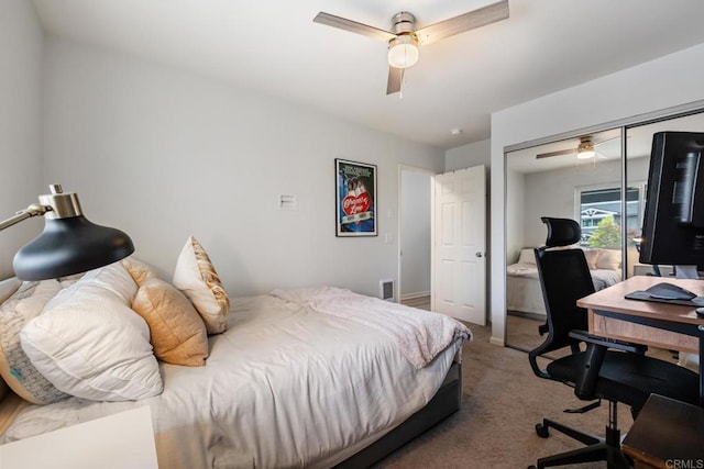 bedroom featuring ceiling fan, a closet, and carpet flooring