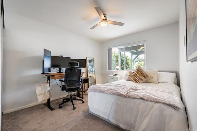 carpeted bedroom featuring ceiling fan and baseboards