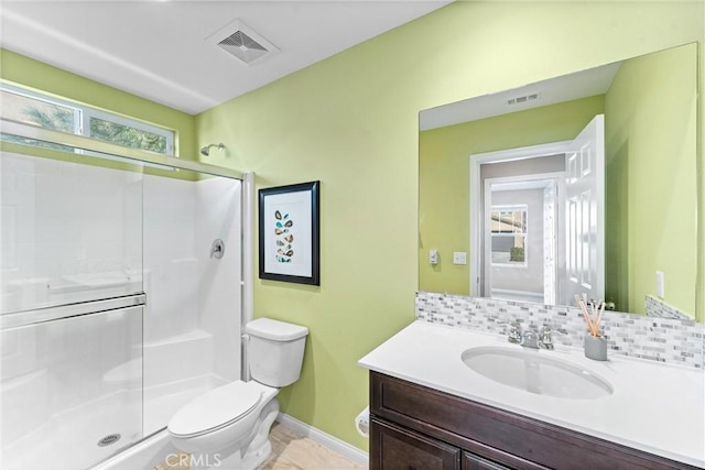 full bathroom with toilet, vanity, visible vents, tasteful backsplash, and a stall shower