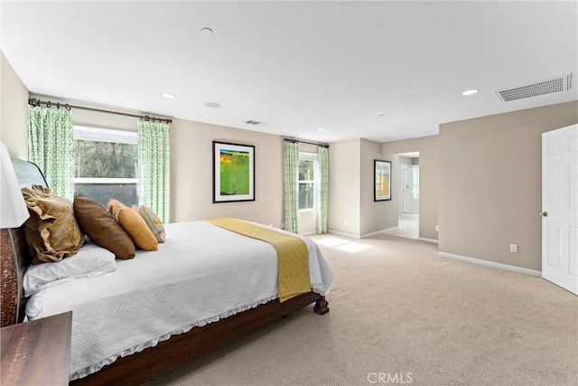 bedroom featuring light carpet, recessed lighting, visible vents, and baseboards