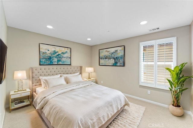 bedroom with light carpet, recessed lighting, visible vents, and baseboards