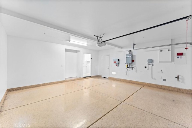 garage featuring baseboards and a garage door opener