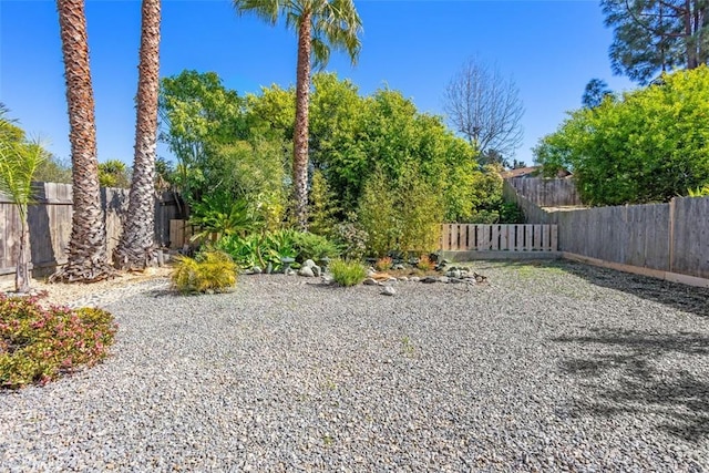 view of yard with a fenced backyard