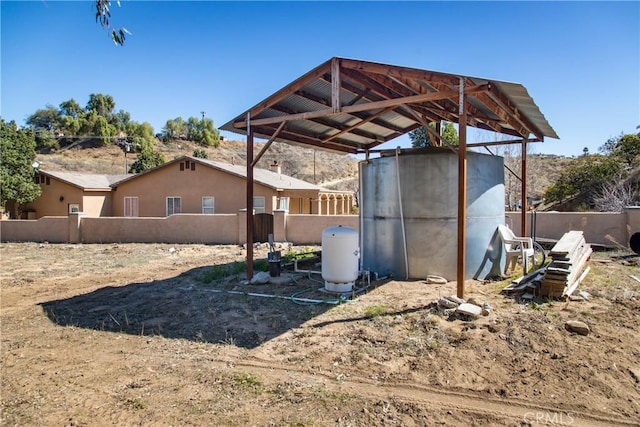 view of outdoor structure featuring fence