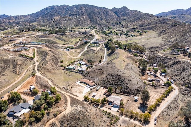 birds eye view of property with a mountain view