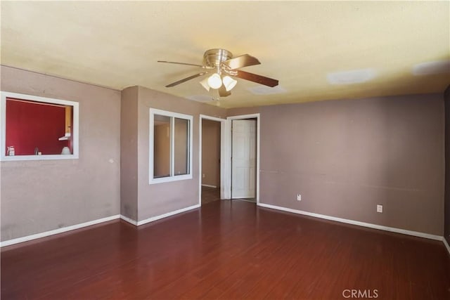 8181 Date St, Fontana, CA 92335 - spare room featuring dark wood-style floors, ceiling fan, and baseboards