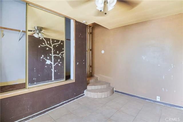 8181 Date St, Fontana, CA 92335 - unfurnished room featuring tile patterned flooring, baseboards, and a ceiling fan
