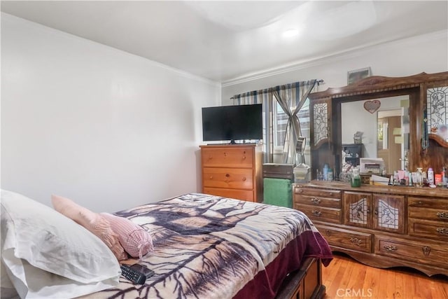 8181 Date St, Fontana, CA 92335 - bedroom featuring ornamental molding and light wood finished floors