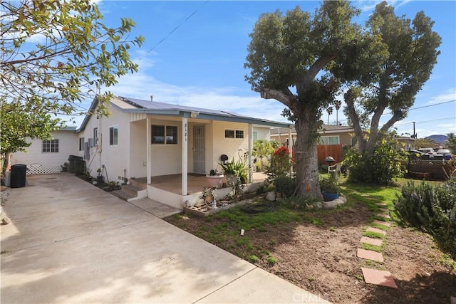8181 Date St, Fontana, CA 92335 - view of front of house featuring fence, metal roof, and stucco siding