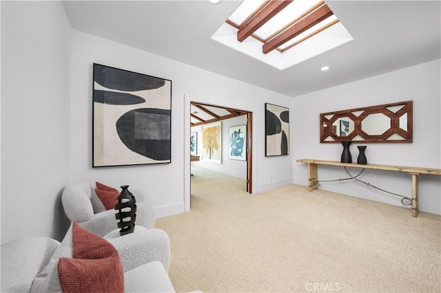 living area featuring carpet floors, recessed lighting, baseboards, and a skylight