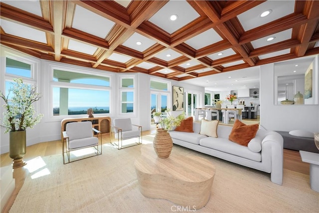 living room with light wood-type flooring, recessed lighting, coffered ceiling, and beamed ceiling