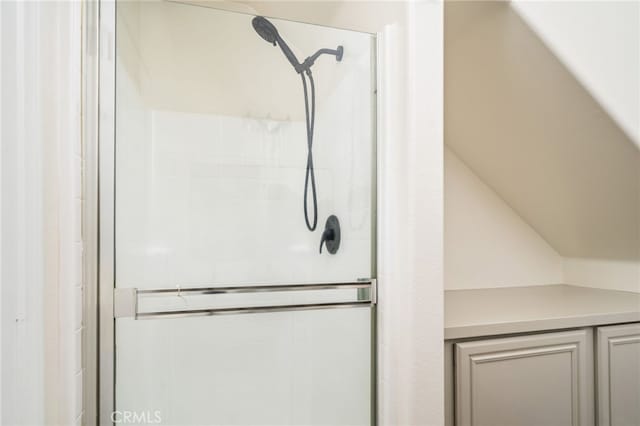 full bath featuring a tile shower