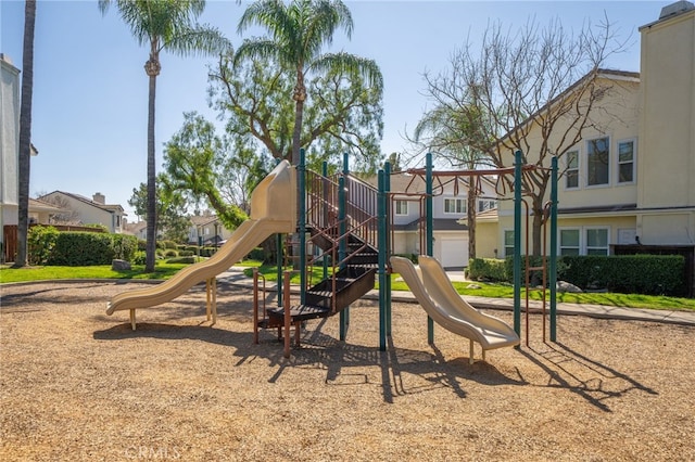 communal playground featuring a residential view