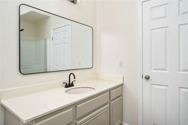 bathroom with vanity and walk in shower