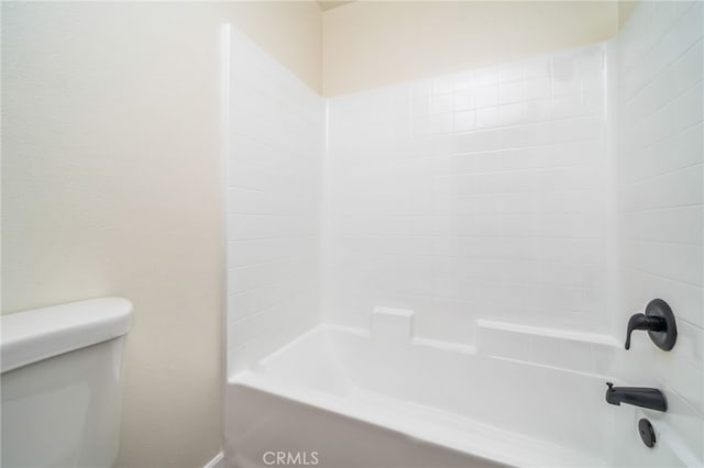 bathroom featuring toilet and shower / washtub combination