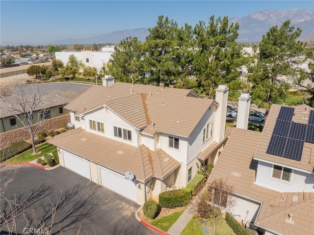 drone / aerial view with a residential view and a mountain view