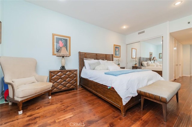 bedroom featuring visible vents, a closet, hardwood / wood-style flooring, and recessed lighting