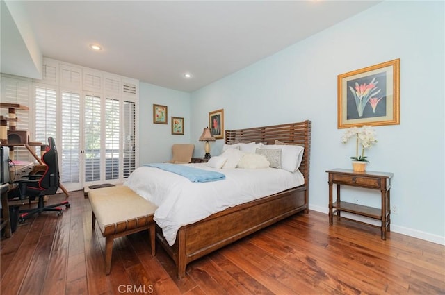 bedroom featuring access to outside, baseboards, hardwood / wood-style floors, and recessed lighting