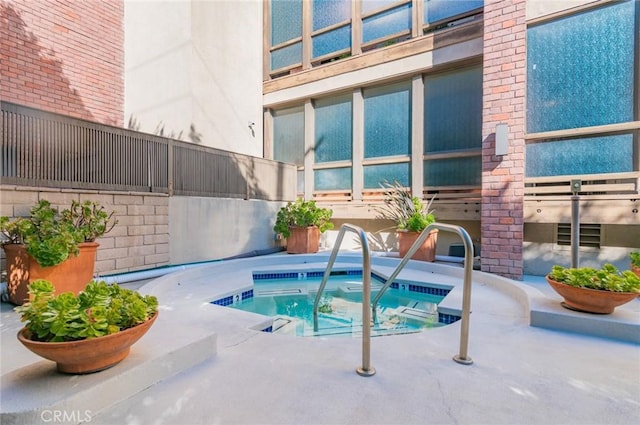 view of pool featuring a community hot tub