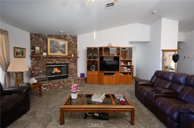 living area with carpet floors, visible vents, a fireplace, ceiling fan, and vaulted ceiling