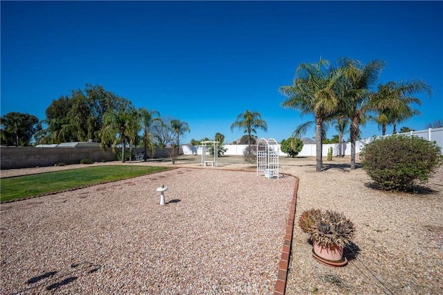 view of home's community with fence