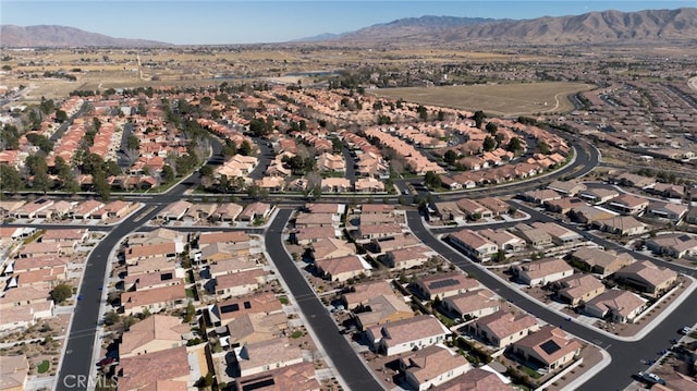 drone / aerial view featuring a residential view and a mountain view