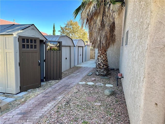 exterior space featuring an outdoor structure and a storage unit