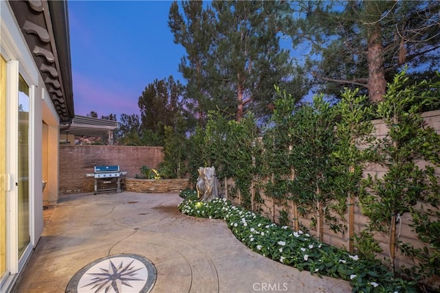 view of patio featuring grilling area and a fenced backyard