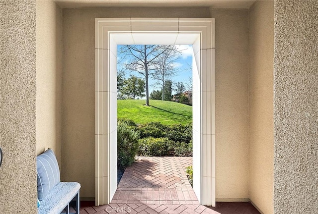 entryway with brick floor